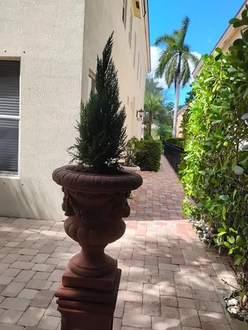 a view of spacious bathroom with a toilet and a shower