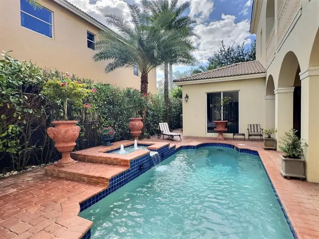 a living room with furniture rug and a table