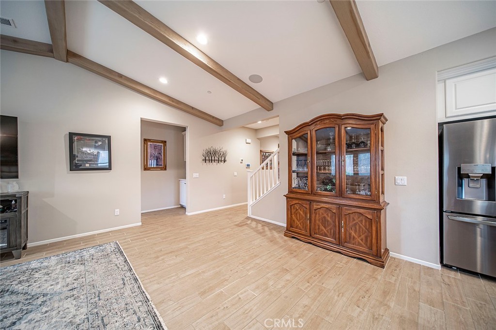 1189 Heritage Drive Calimesa, CA 92320 - Photo 11 of 36 a view of a living room with kitchen island wooden floor and furniture