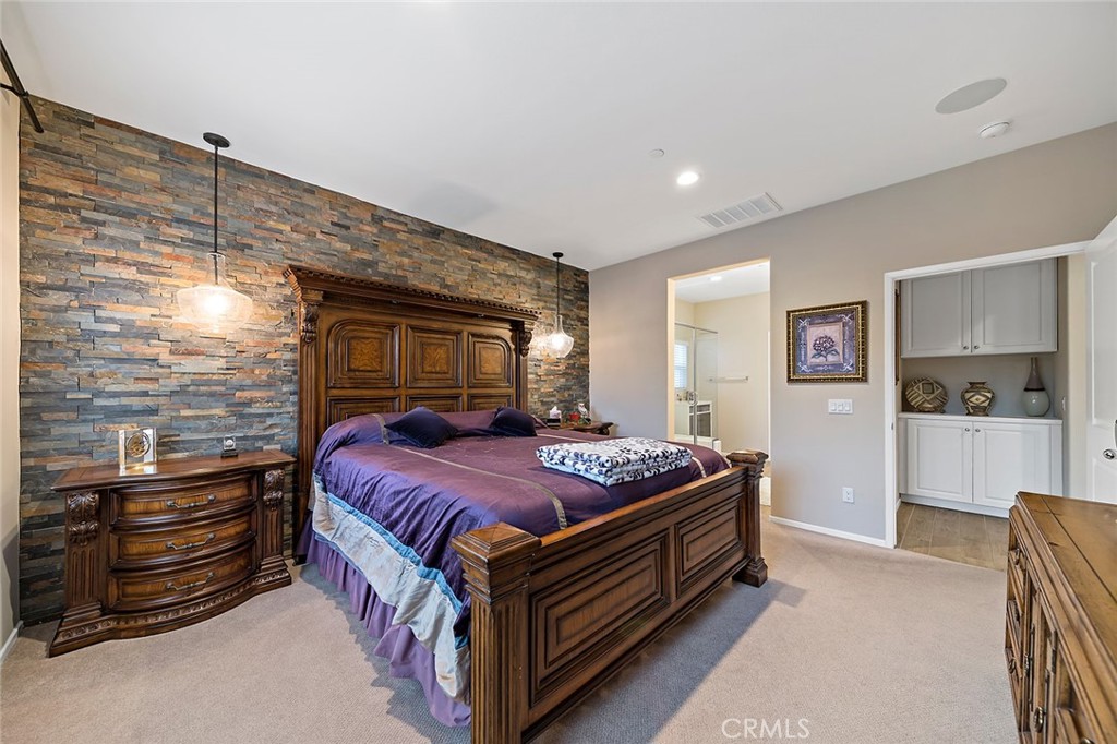 1189 Heritage Drive Calimesa, CA 92320 - Photo 12 of 36 a bedroom with a bed and a dresser in it