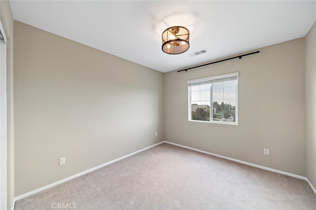 1189 Heritage Drive Calimesa, CA 92320 - Photo 18 of 36 an empty room with a window