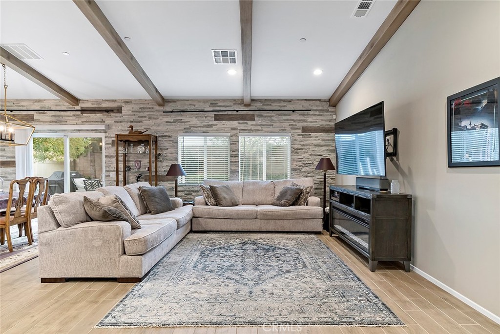 1189 Heritage Drive Calimesa, CA 92320 - Photo 2 of 36 a living room with furniture wooden floor and ceiling fan