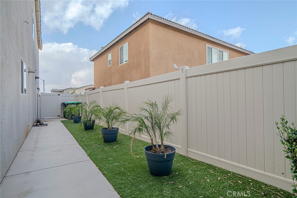 1189 Heritage Drive Calimesa, CA 92320 - Photo 28 of 36 a house view with a garden space