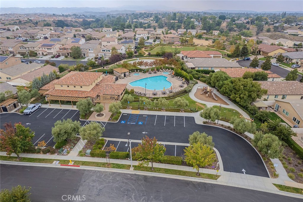 1189 Heritage Drive Calimesa, CA 92320 - Photo 32 of 36 an aerial view of residential houses with outdoor space and parking