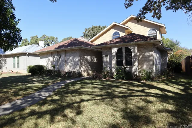 a view of a house with a yard