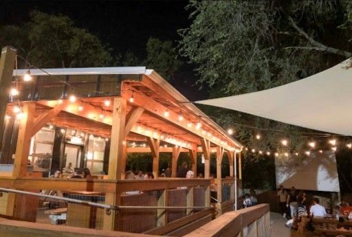 a view of a patio with a table and chairs