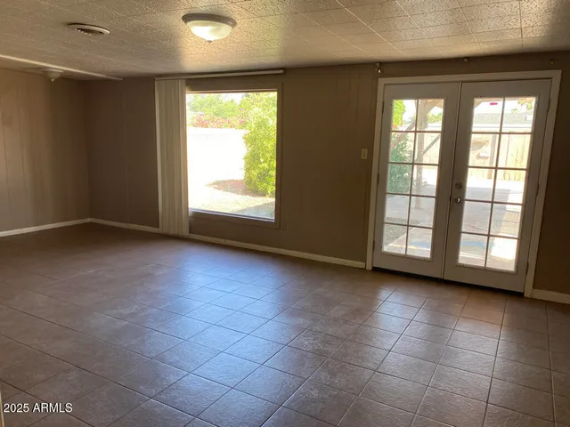 a view of an empty room and a window