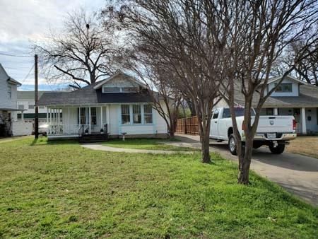 921 West Oak Street Denton, TX 76201 - Photo 22 of 23 a front view of a house with garden