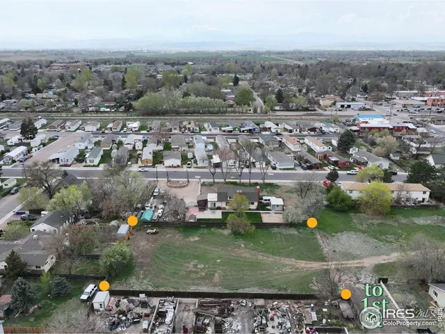 an aerial view of a house with a garden