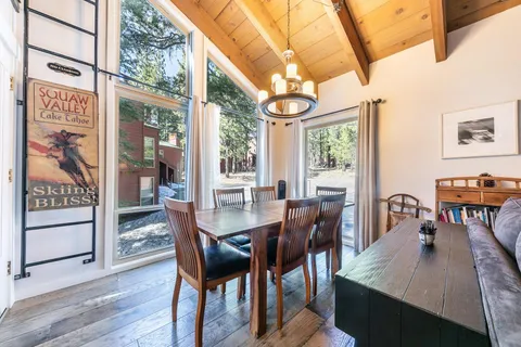 a dining room with a table and chairs