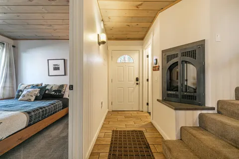 a bedroom with a bed and a couch