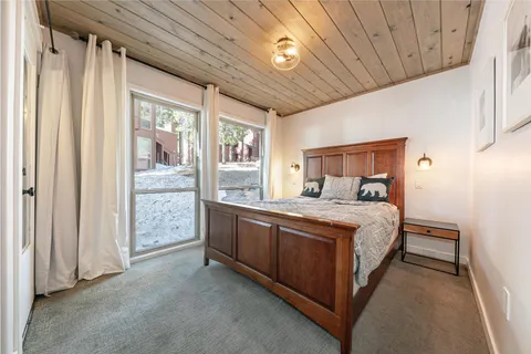 a bed room with a bed and a window