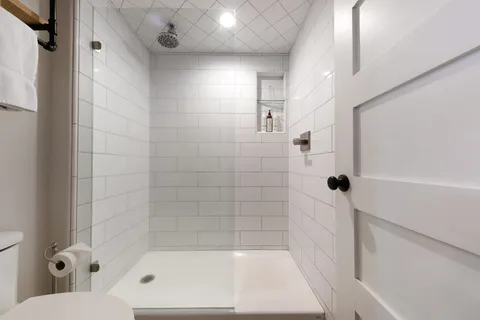 a bedroom with a bed and a cabinets