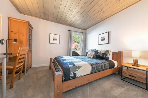 a bedroom with a bed and a walk in closet