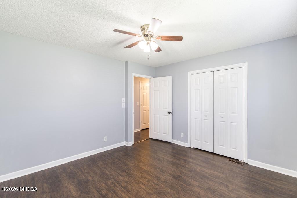 3710 Sandy Circle Macon, GA 31216 - Photo 17 of 44 a view of an empty room with wooden floor and a ceiling fan