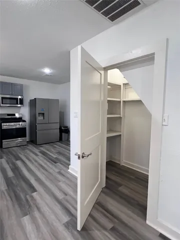 a utility room with sink and washing machine
