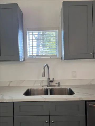 a stove top oven sitting inside of a kitchen