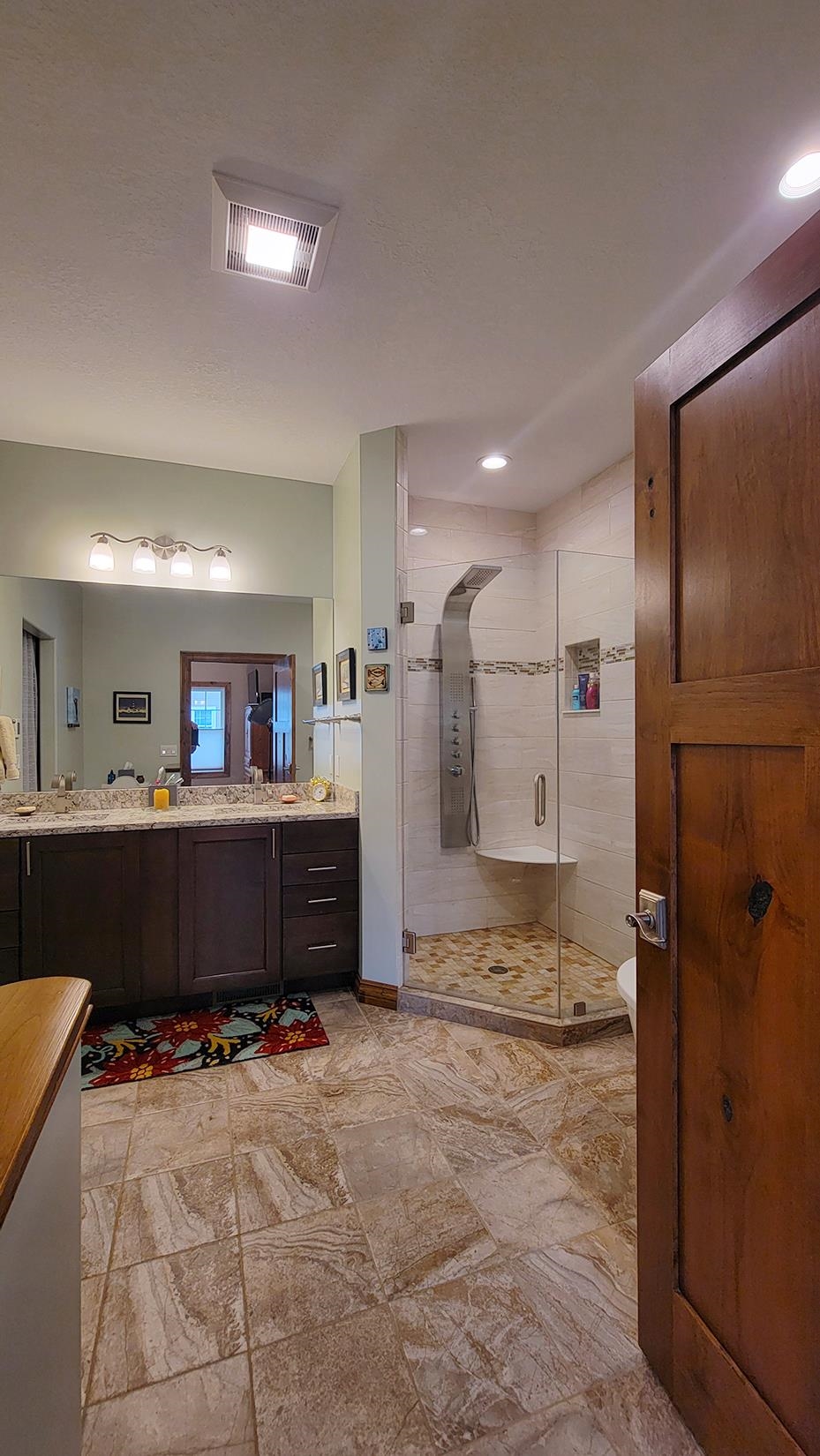 2149 Avon Drive Traverse City, MI 49685 - Photo 19 of 46 With low threshold walk-in shower and soaking tub