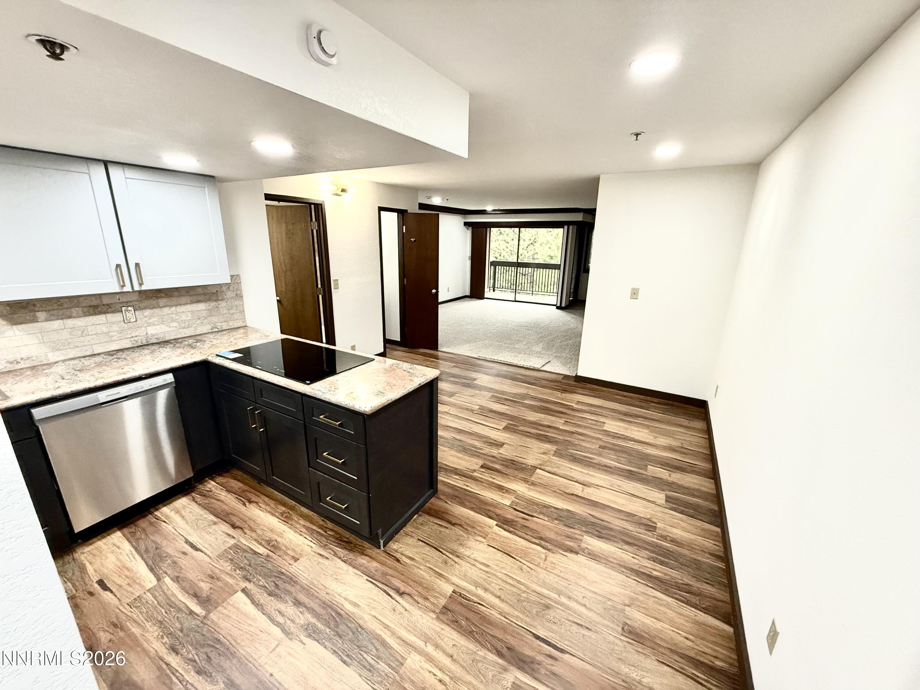 333 Ski Way, Unit 279 Incline Village, NV 89451 - Photo 1 of 43 a living room with stainless steel appliances kitchen island granite countertop a refrigerator and a stove top oven