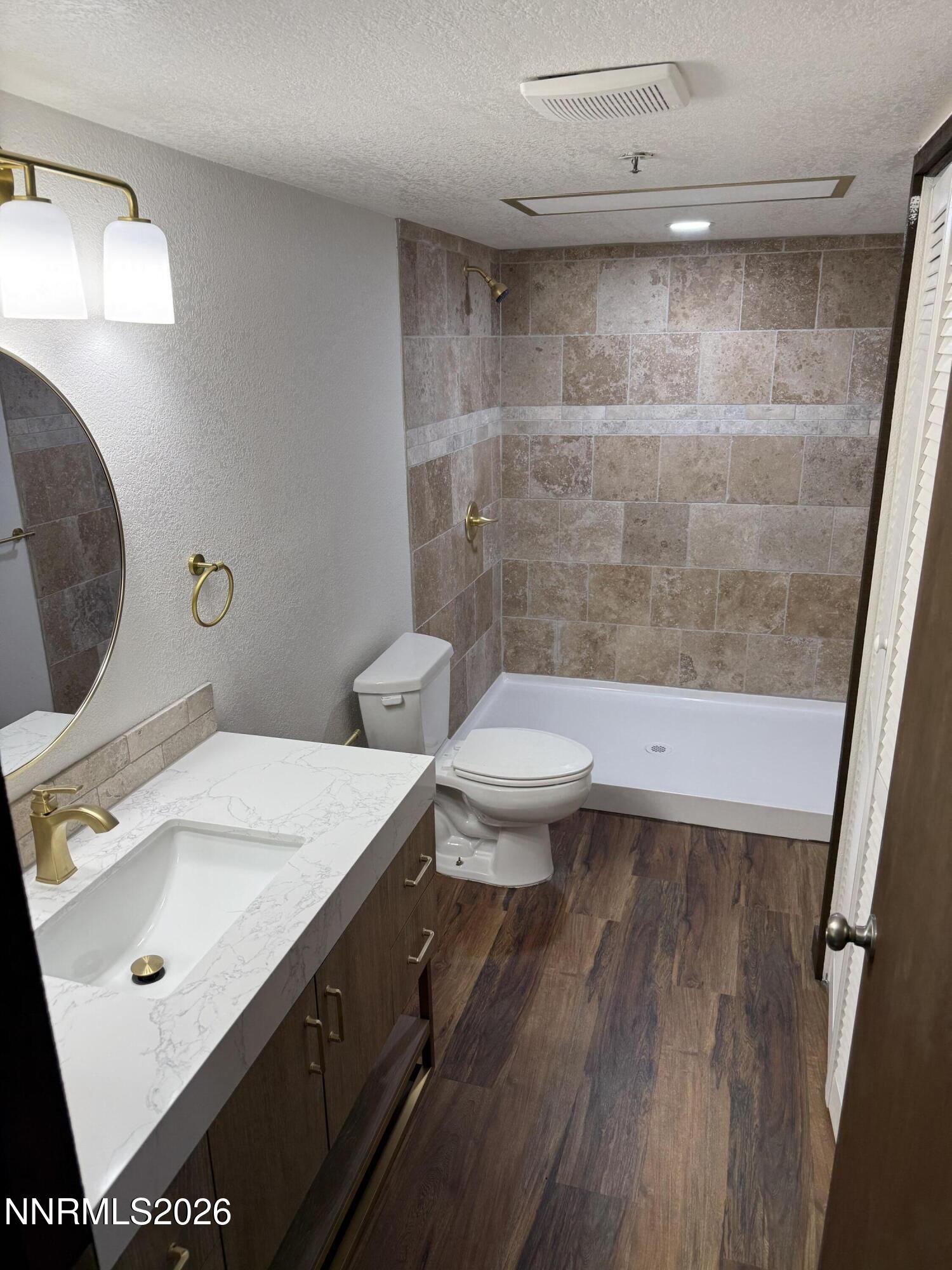 333 Ski Way, Unit 279 Incline Village, NV 89451 - Photo 19 of 43 a bathroom with a sink a toilet and a mirror
