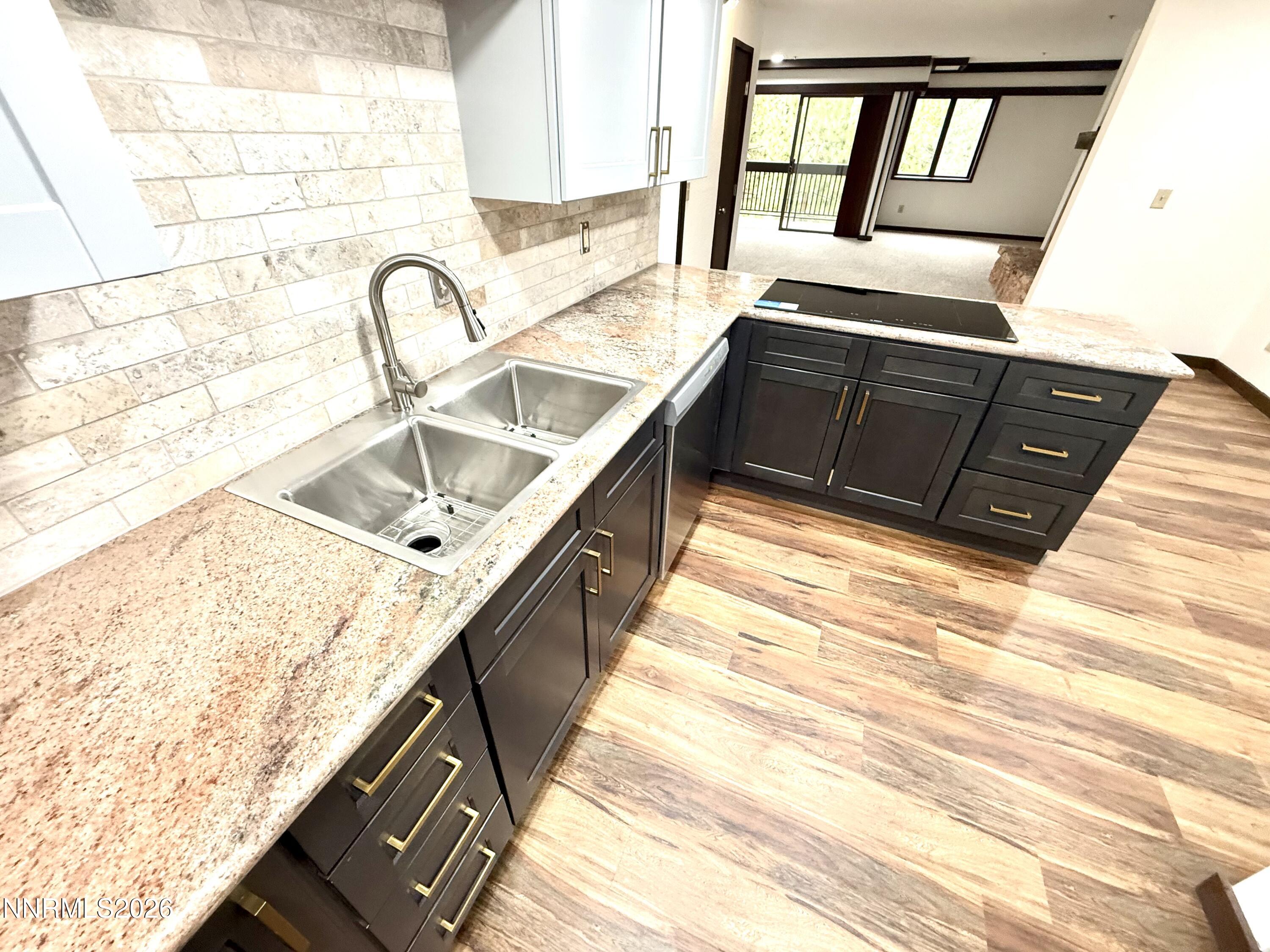 333 Ski Way, Unit 279 Incline Village, NV 89451 - Photo 2 of 43 a kitchen with granite countertop a sink and a stove