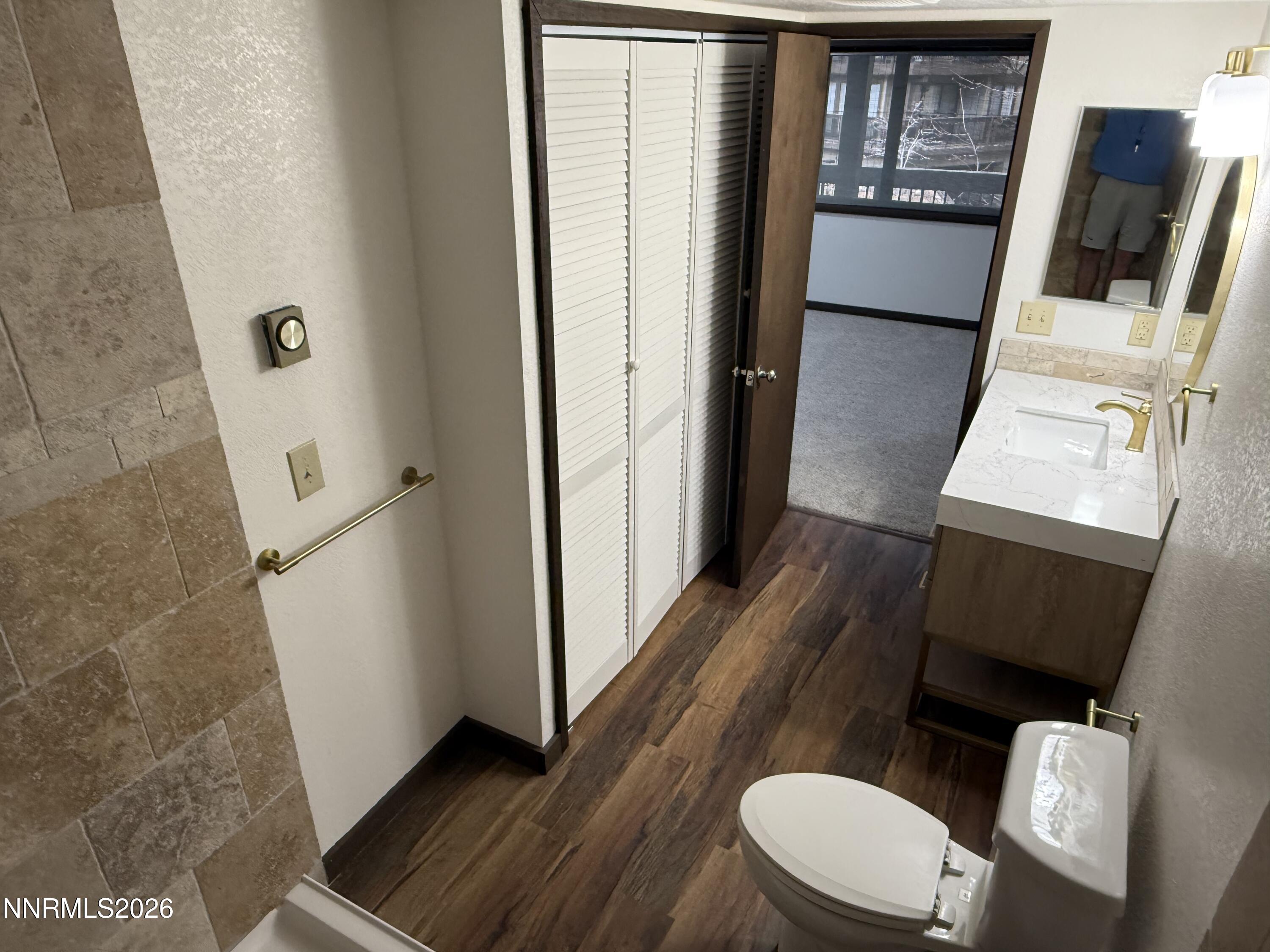 333 Ski Way, Unit 279 Incline Village, NV 89451 - Photo 21 of 43 a bathroom with a toilet a sink and a mirror
