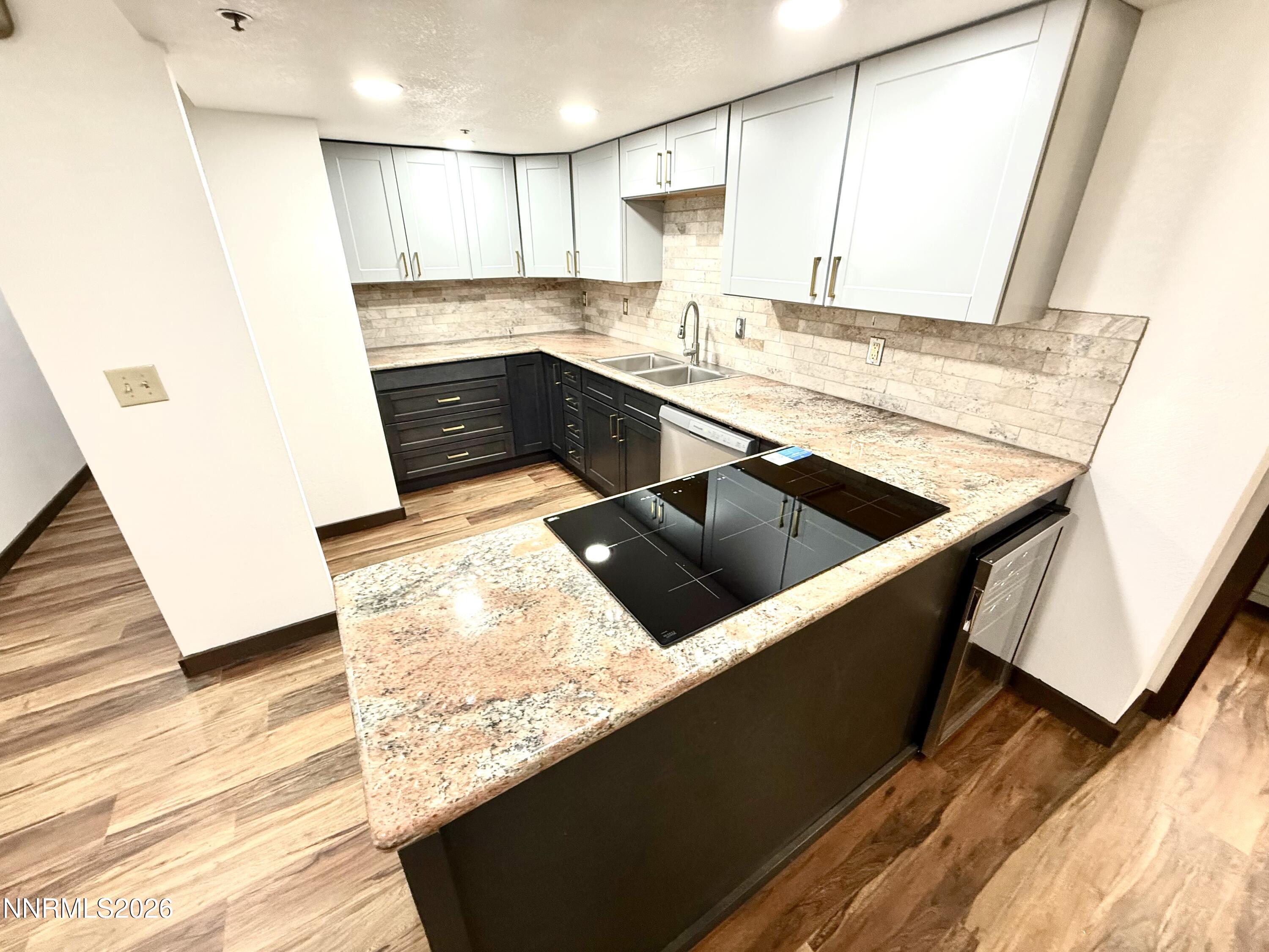 333 Ski Way, Unit 279 Incline Village, NV 89451 - Photo 5 of 43 a kitchen with a sink and a stove