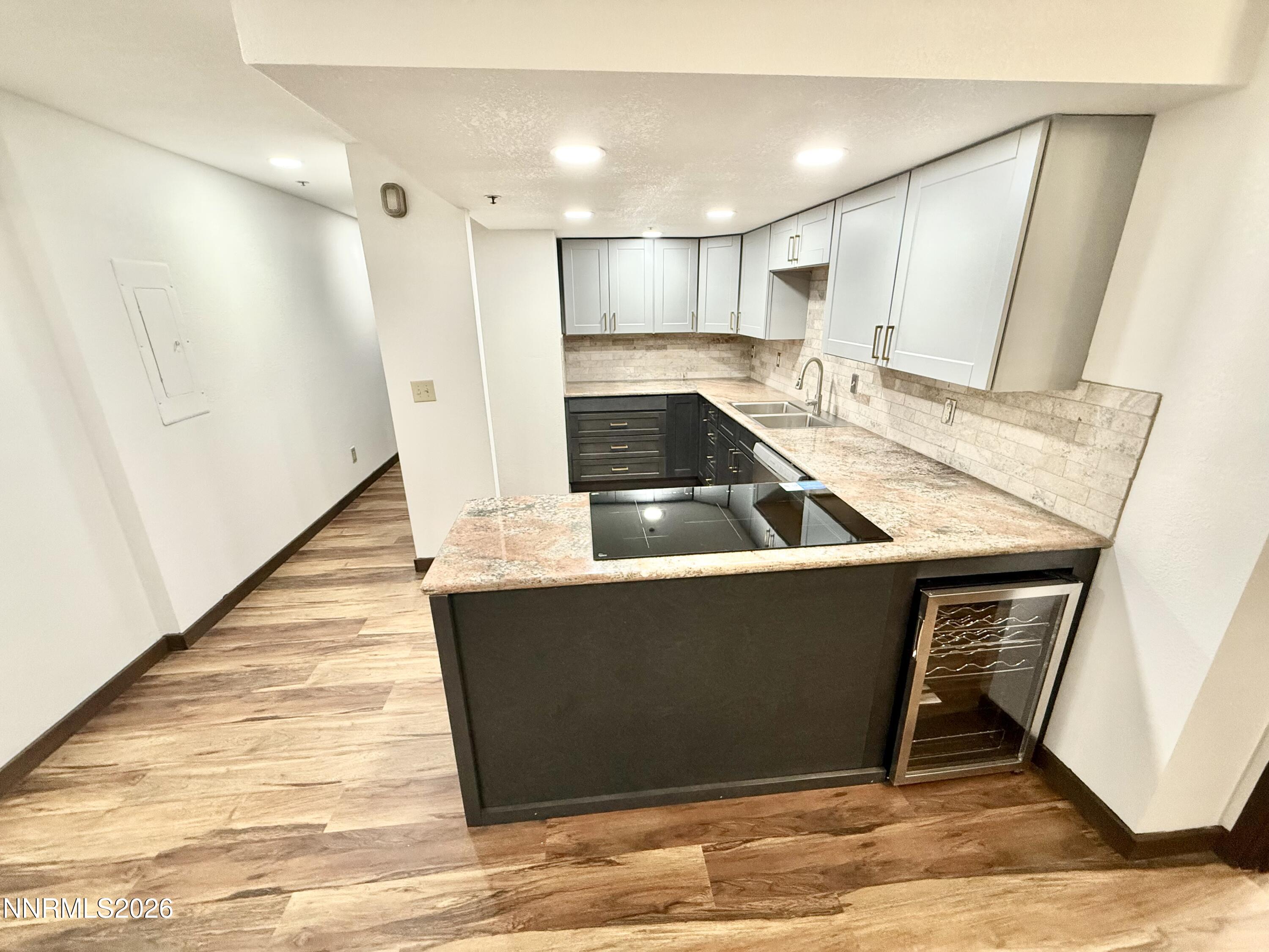 333 Ski Way, Unit 279 Incline Village, NV 89451 - Photo 8 of 43 a kitchen with kitchen island a counter top space and a sink