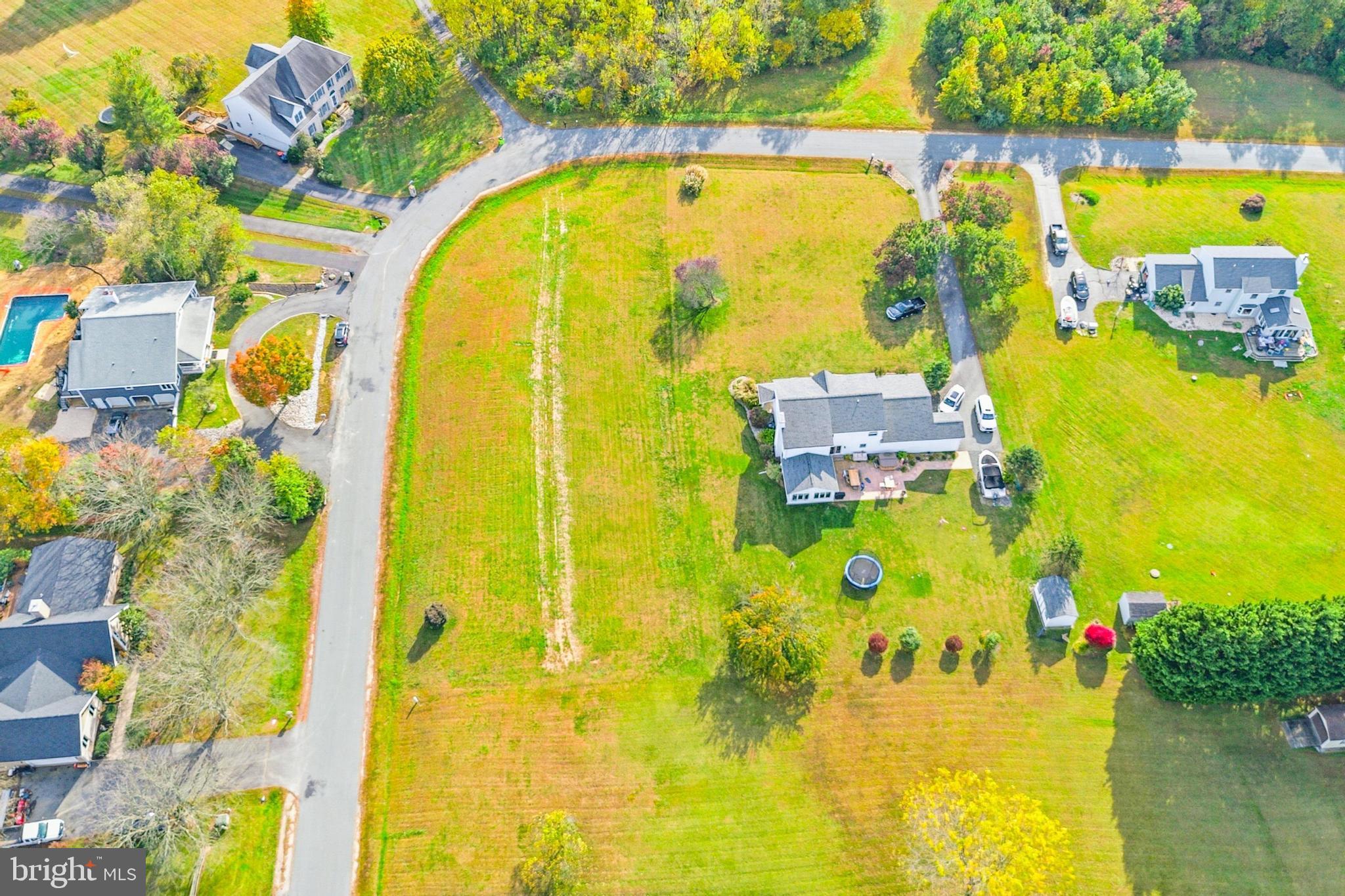 108 Lance Court Elkton, MD 21921 - Photo 8 of 15 a view of a swimming pool with a table and chairs
