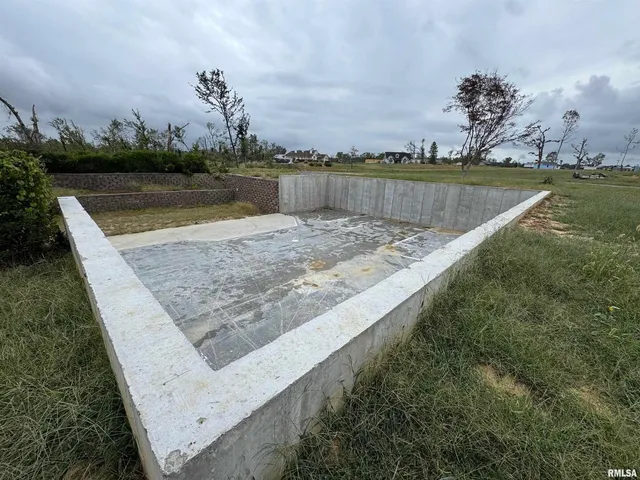 a view of a swimming pool with a lake