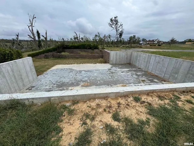 a view of a lake with houses in the back