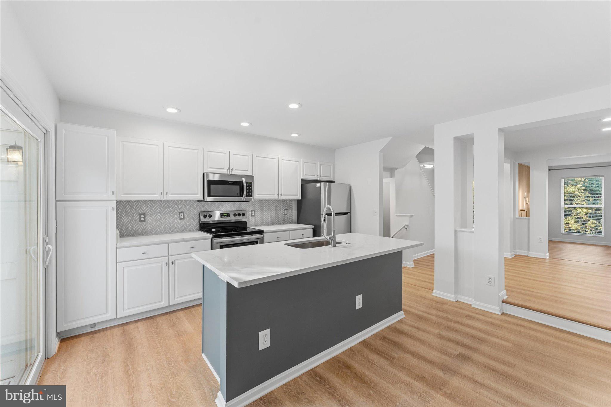 12066 Edgemere Circle Reston, VA 20190 - Photo 16 of 41 Bright kitchen with view to family room