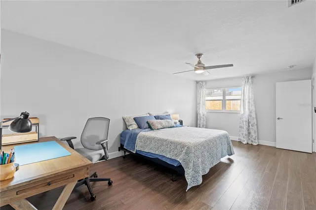 a bathroom with a double vanity sink toilet and mirror