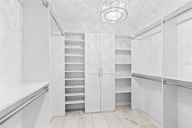 a bed room with two bed and a ceiling fan