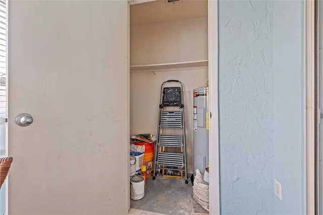 a view of a chair and table in patio with a fire pit