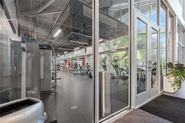 a view of a chairs and bench in the room