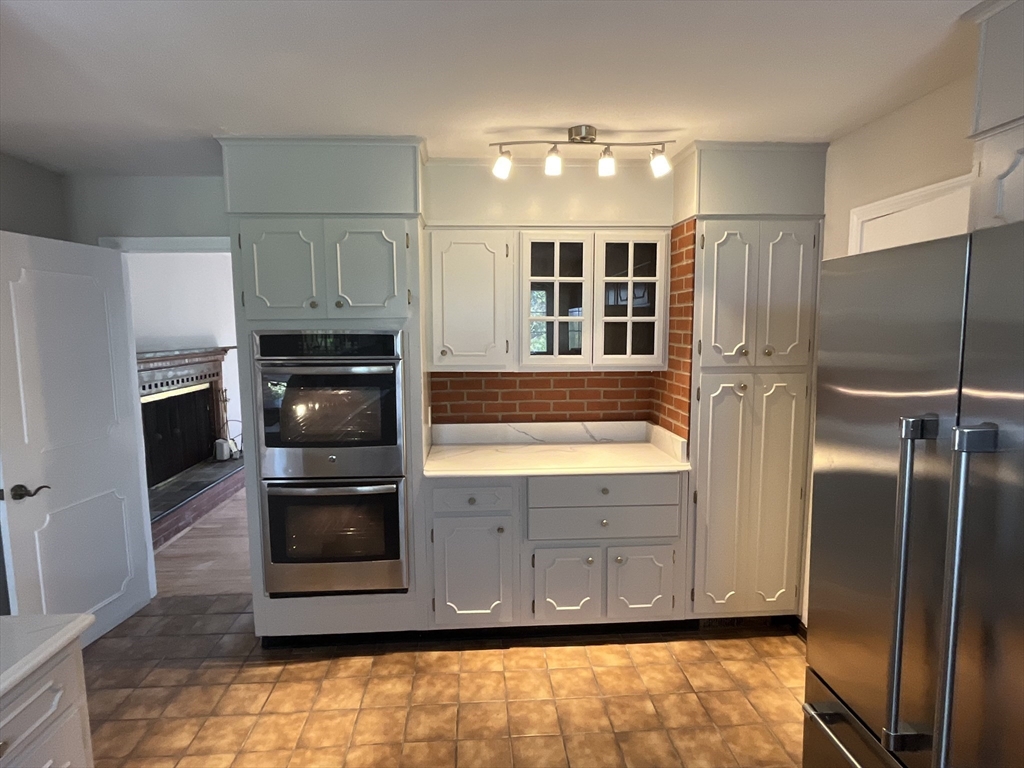 12 Woodland Road Westfield, MA 01085 - Photo 12 of 29 a kitchen with stainless steel appliances granite countertop a refrigerator and a sink