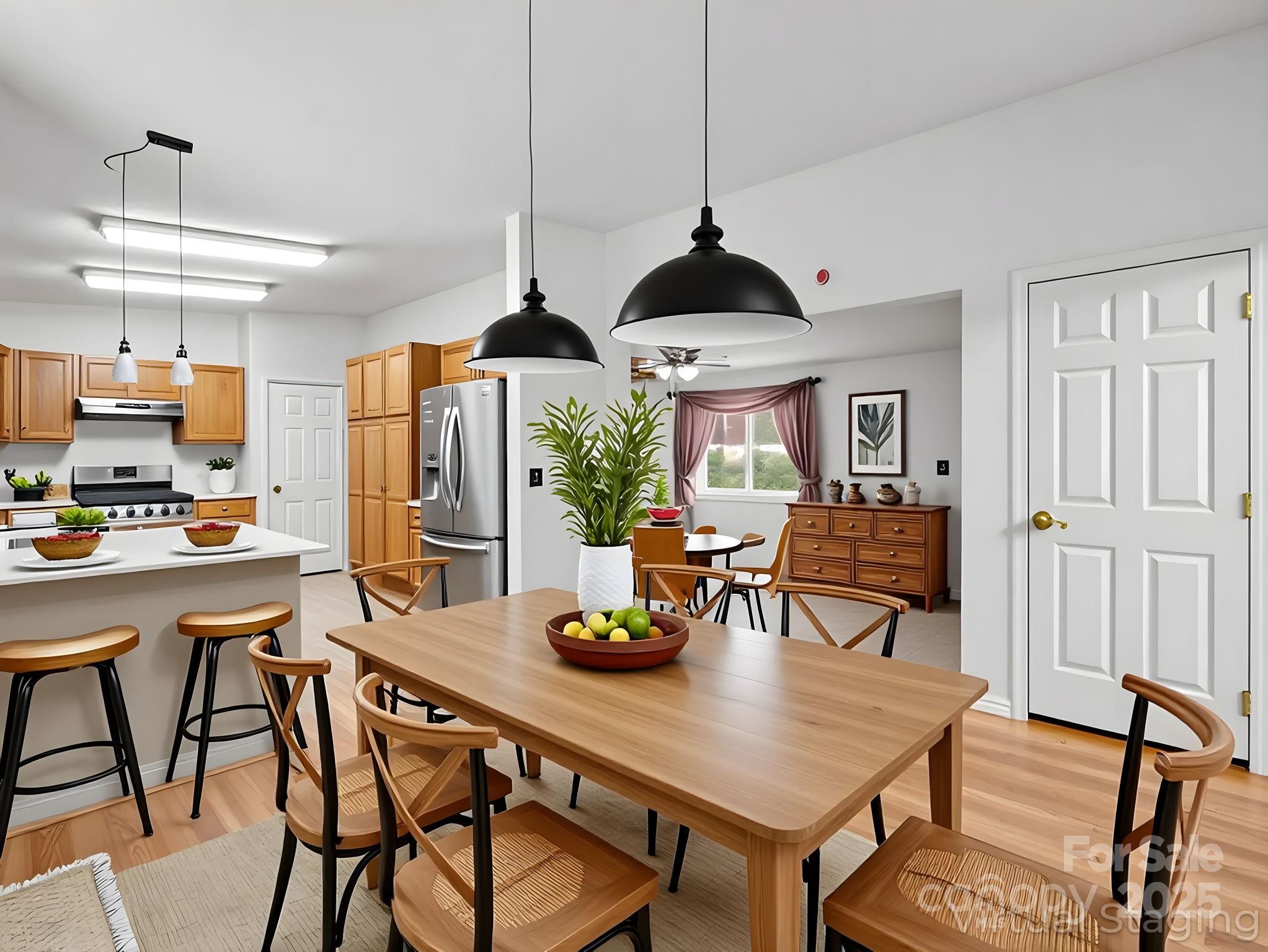 262 Daisy Lane Bostic, NC 28018 - Photo 12 of 48 a kitchen with stainless steel appliances a dining table chairs and white cabinets