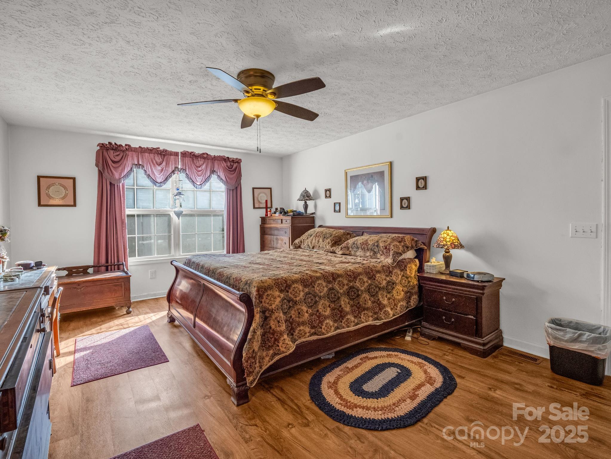 262 Daisy Lane Bostic, NC 28018 - Photo 16 of 48 a bed sitting in a bedroom next to a window