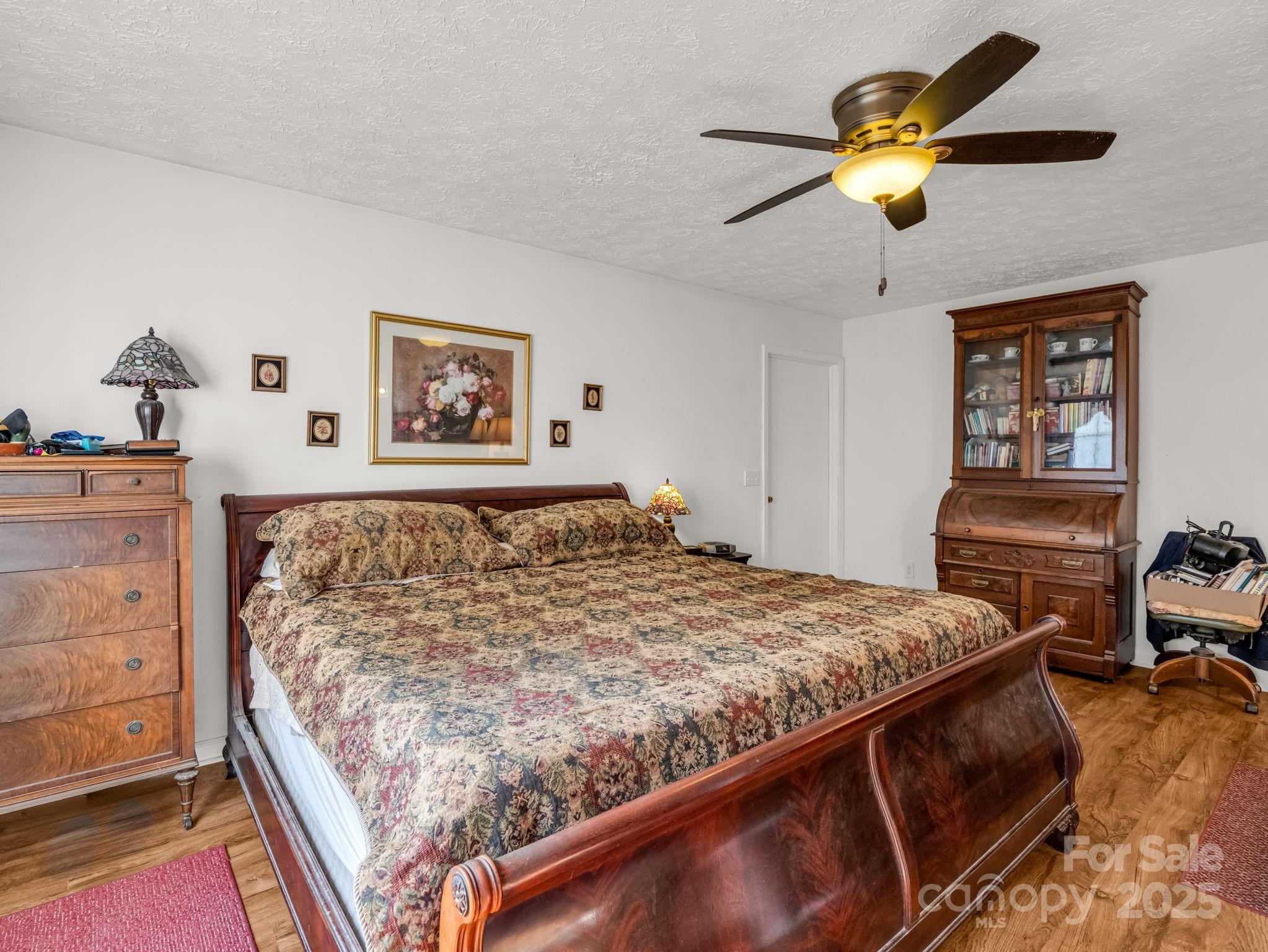 262 Daisy Lane Bostic, NC 28018 - Photo 17 of 48 a bed sitting in a bedroom and chandelier