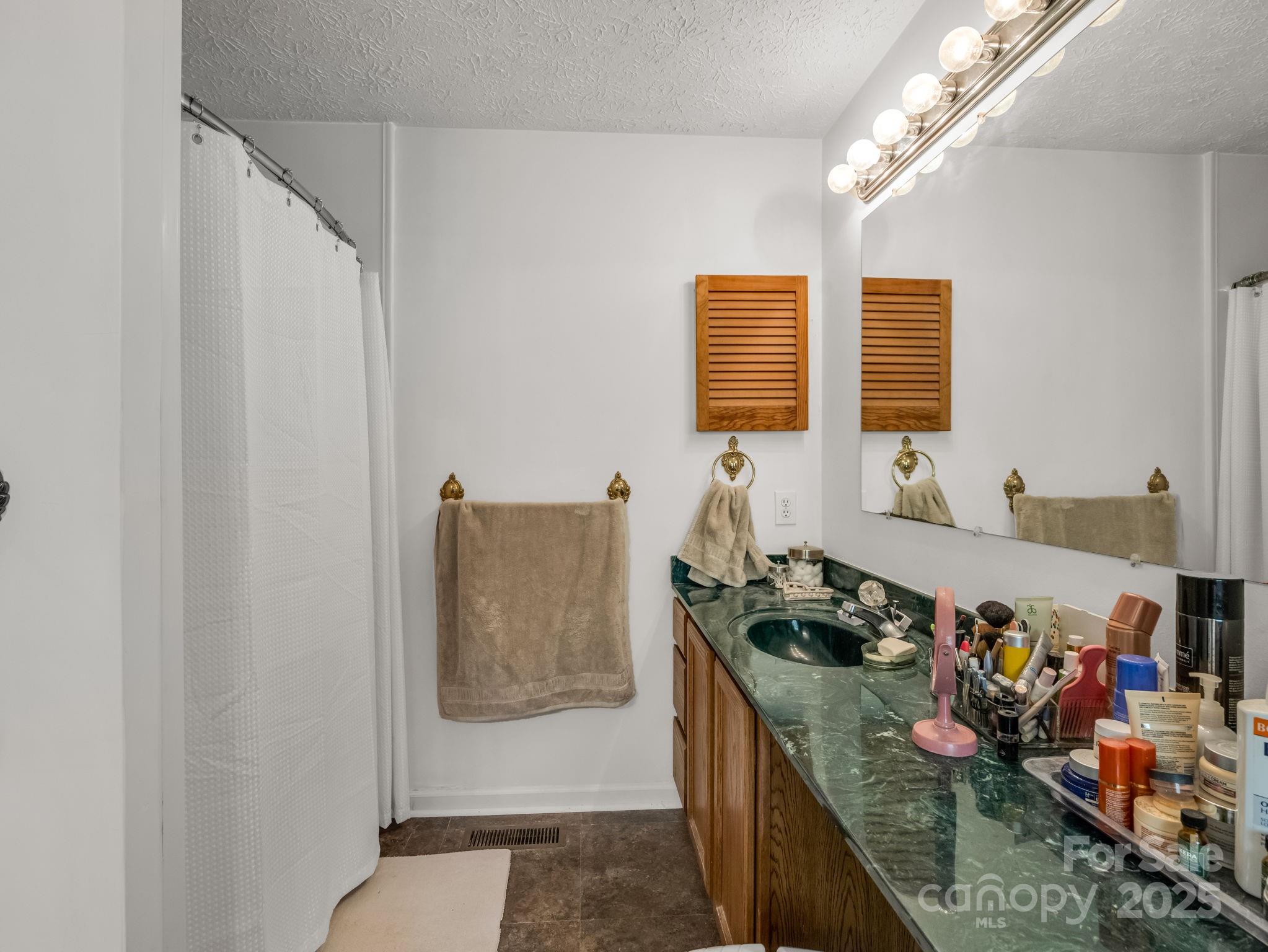 262 Daisy Lane Bostic, NC 28018 - Photo 20 of 48 a kitchen with stainless steel appliances granite countertop a stove and a sink