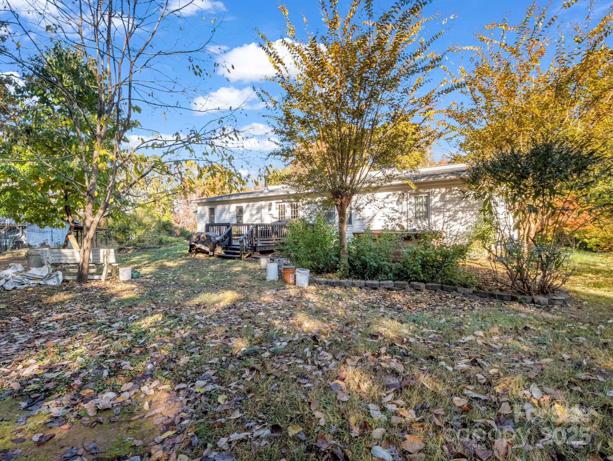 262 Daisy Lane Bostic, NC 28018 - Photo 38 of 48 a view of a yard with plants and trees