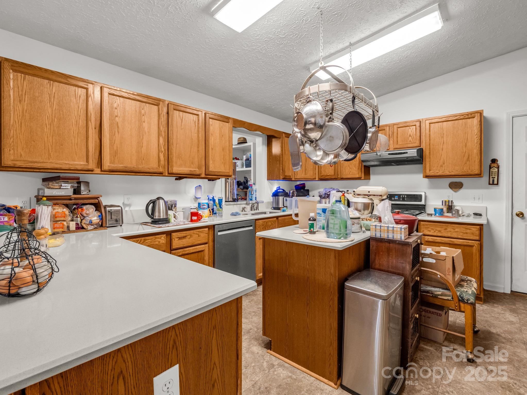 262 Daisy Lane Bostic, NC 28018 - Photo 42 of 48 a room with stainless steel appliances granite countertop a sink dishwasher stove with cabinets and couches