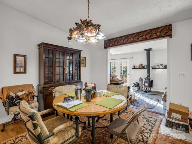 a living room with lots of furniture and gym equipment