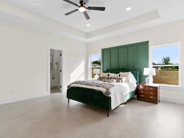 a bed room with furniture and a window