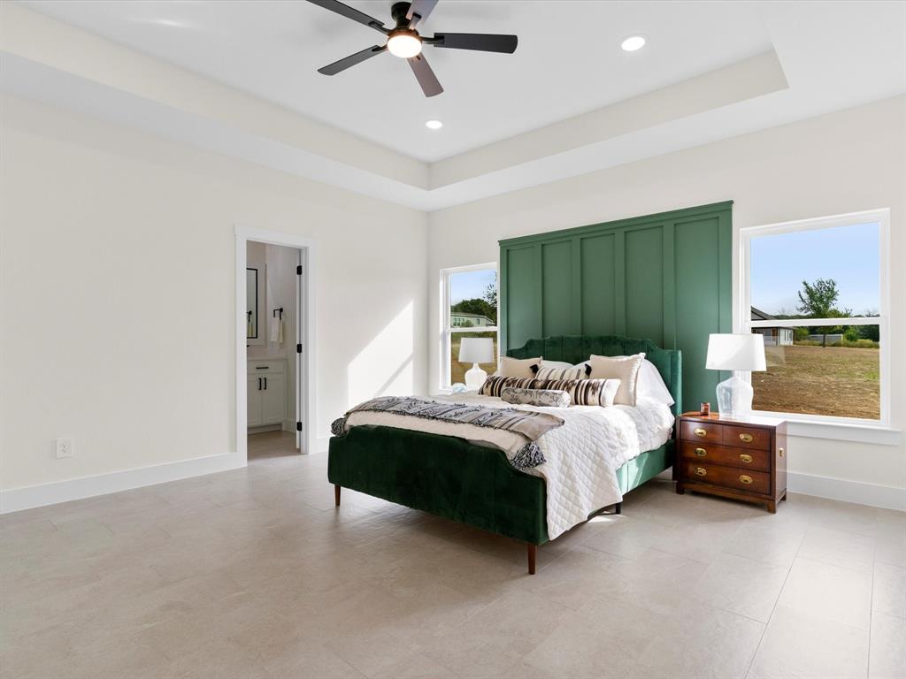 1623 County Road 4764 Boyd, TX 76023 - Photo 11 of 29 a bed room with furniture and a window