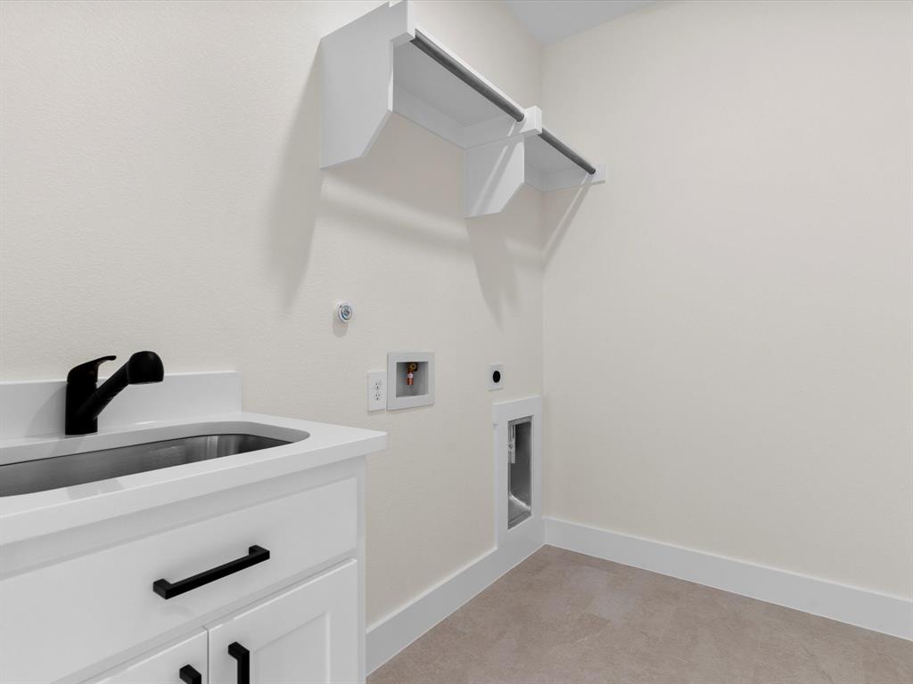 1623 County Road 4764 Boyd, TX 76023 - Photo 21 of 29 a kitchen with a sink and cabinets