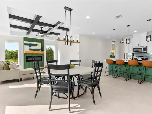 a view of a dining area with furniture window and wooden floor