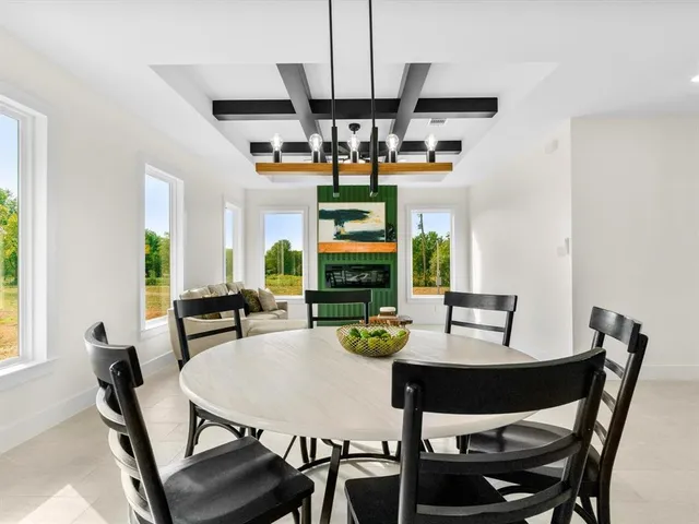 a view of a dining room with furniture window and outside view