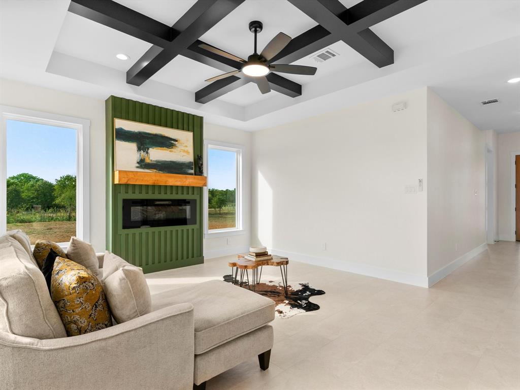 1623 County Road 4764 Boyd, TX 76023 - Photo 7 of 29 a living room with furniture and a floor to ceiling window